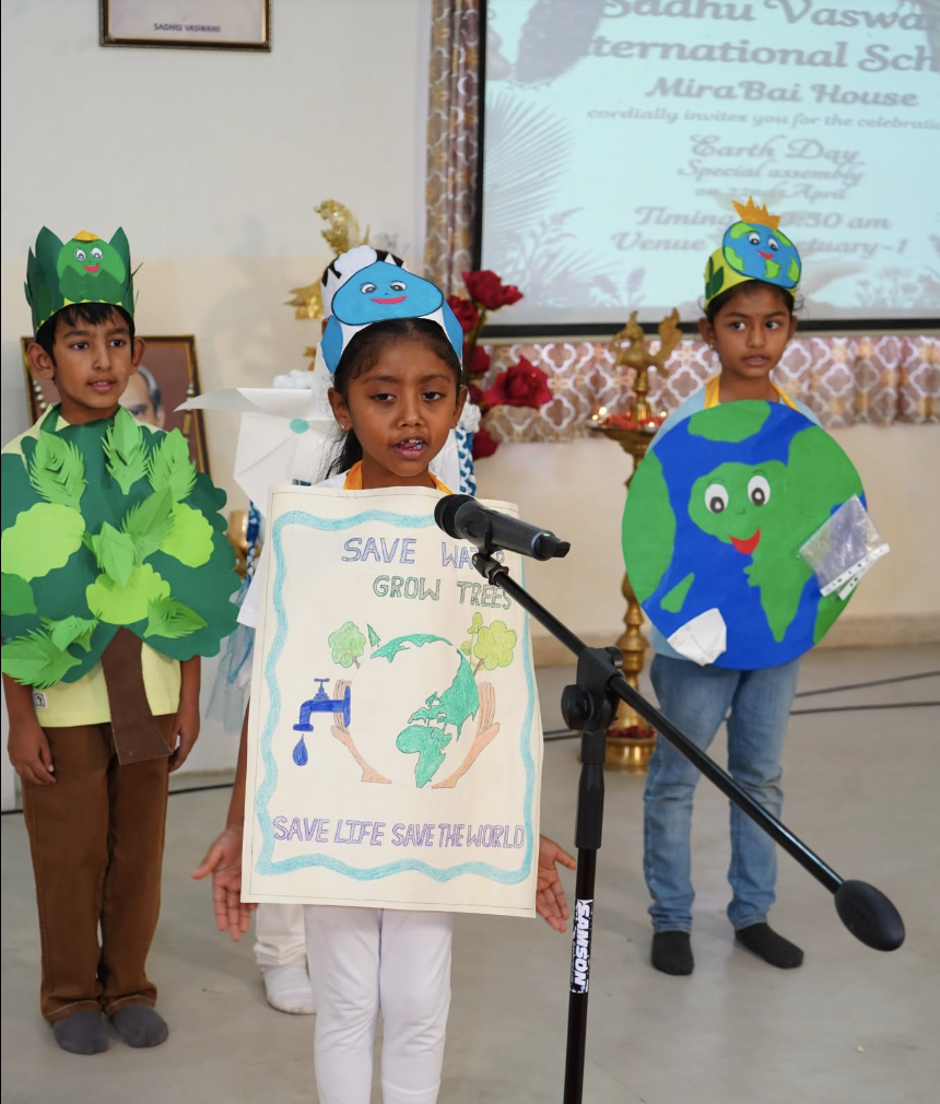 Little Lamps child with Save Water poster